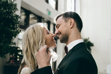 A beautiful couple is hugging and admires the sunset. Romantic date on the beach. Wedding. Artwork.