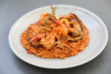 seafood risotto with mussel shrimp and squid , italian food