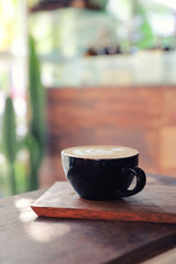 Cappuccino coffee break on wood background