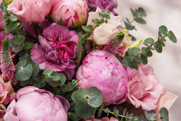 Bouquet of pink bud peonies and carnation closeup	