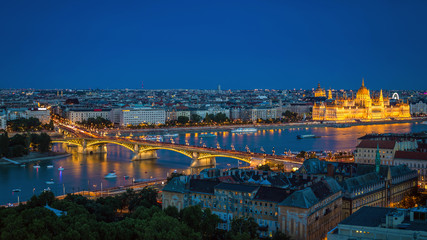 Budapest, Hungary - Panoramic skyline view of Budapest at blue hour with the illuminated Parliament...
