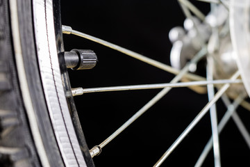 Kids bike. Shock absorber, brake, wheel shown close up.