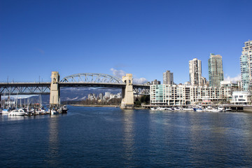 Fototapeta na wymiar Cityscape with Bridge Over the River 