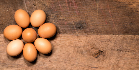Pattern of eggs on rustic wooden table for Easter