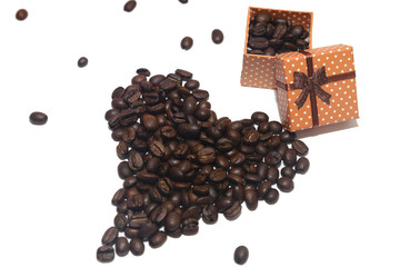 Heart made of coffee beans and a gift box filled with grains