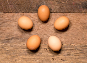 Pattern of eggs on rustic wooden table for Easter