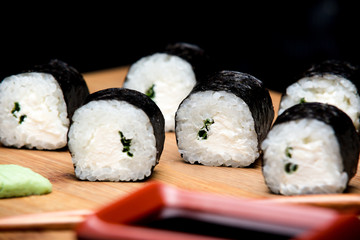 Maki Sushi with and spring onion inside.