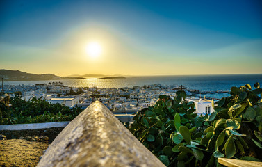 Mykonos island aerial panoramic view at sunset. Mykonos is a island, part of the Cyclades in Greece with old architecture one the foreground