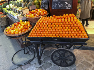 Row of tangerines in a barrow