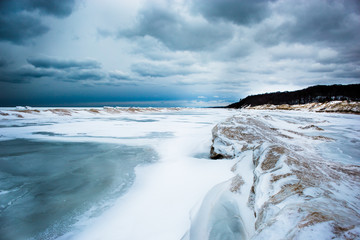 Sand dunes and frozen waves on cloudy day