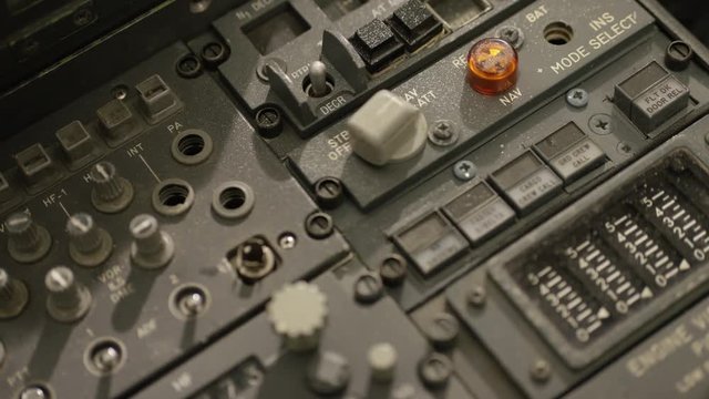 Hand turns control knobs closeup
