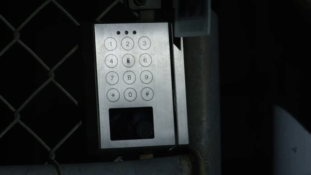 Swiping a key card on an access gate