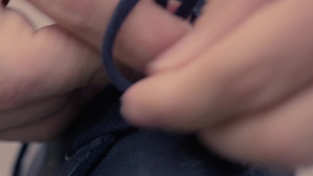 Tying shoelaces closeup