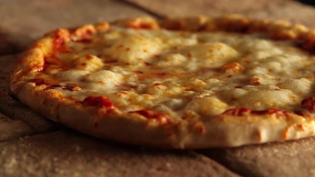 Cheese on pizza bubbling in oven
