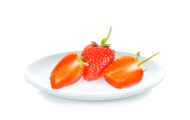 Strawberry in white plate on white background