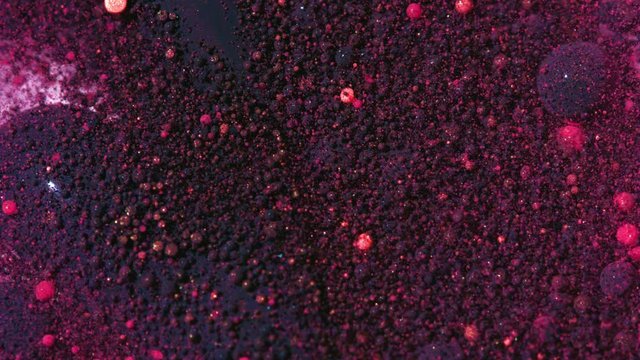 Top view Bright Collors Bubbles Slow Motion Oil Ink is fantastic structure of colorful chaotic motion bubbles stock video is a beautiful, unique, organic 4K clip.