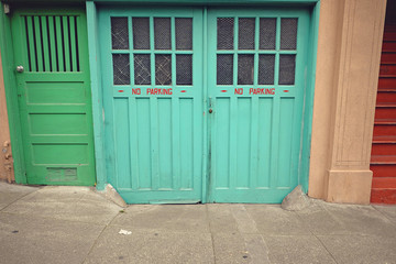 Green wooden and glass rustic doors