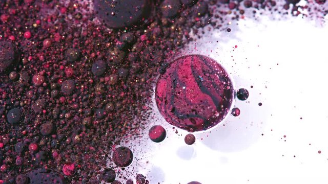 Top view Bright Collors Bubbles Slow Motion Oil Ink is fantastic structure of colorful chaotic motion bubbles stock video is a beautiful, unique, organic 4K clip.