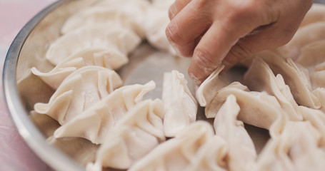 Making of meat dumpling at home © leungchopan