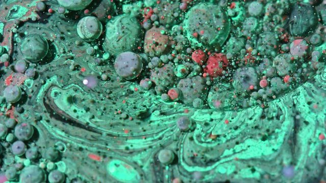 Top view Bright Collors Bubbles Slow Motion Oil Ink is fantastic structure of colorful chaotic motion bubbles stock video is a beautiful, unique, organic 4K clip.