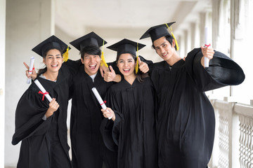 Graduation day, Images of Happily graduates are celebrating graduation, a certificate in hand,...