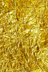 Shiny yellow leaf gold foil texture background