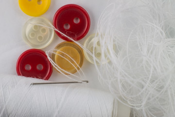 Needle with thread and buttons