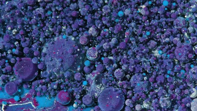 Top view Bright Collors Bubbles Slow Motion Oil Ink is fantastic structure of colorful chaotic motion bubbles stock video is a beautiful, unique, organic 4K clip.