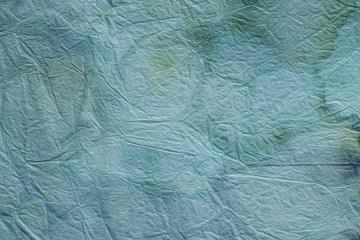 blue painted creased tissuse paper background texture