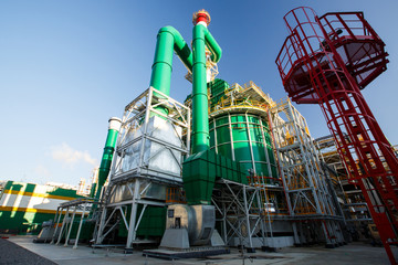 colored buildings and structures in the territory of a large factory