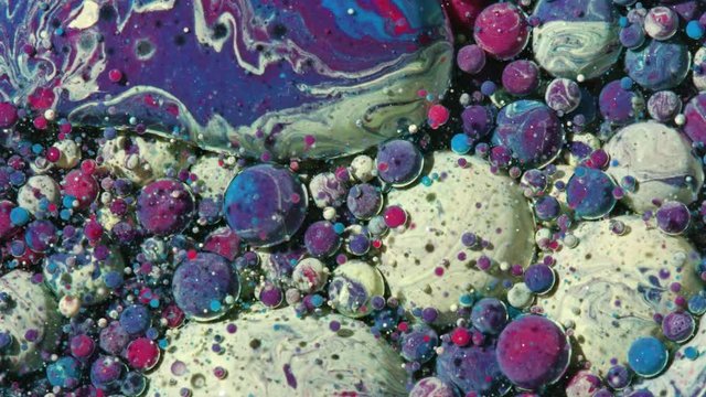 Top view Bright Collors Bubbles Slow Motion Oil Ink is fantastic structure of colorful chaotic motion bubbles stock video is a beautiful, unique, organic 4K clip.