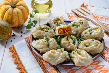 Delicious, mouth-watering dish of South Caucasian, Central Asian cuisine - Manti filled with pumpkin