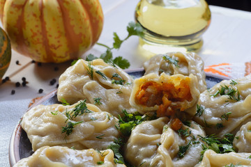 Delicious, mouth-watering dish of South Caucasian, Central Asian cuisine - Manti filled with pumpkin