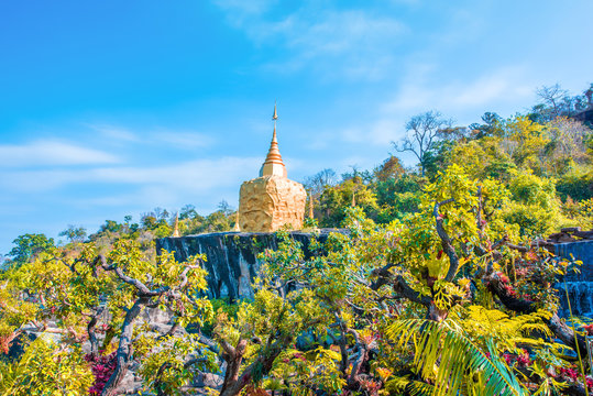 Golden pagoda sculpture,stone carving at Wat Tham Pha Daen.Sakon Nakhon province,Thailand.
