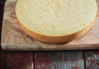 sponge cake on old wooden table.
