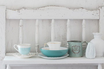  dinnerware on white wooden shelf