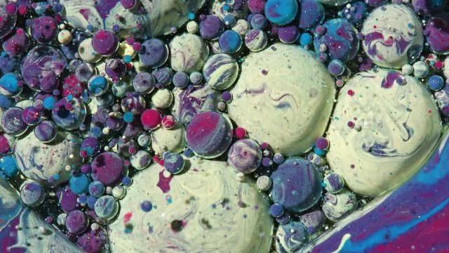 Top view Bright Collors Bubbles Slow Motion Oil Ink is fantastic structure of colorful chaotic motion bubbles stock video is a beautiful, unique, organic 4K clip.