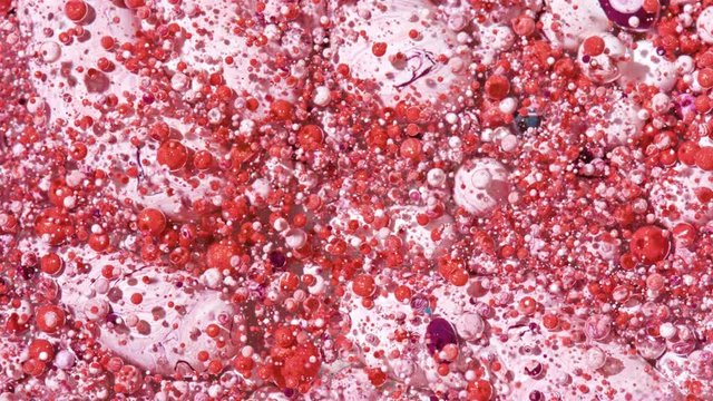 Top view Bright Collors Bubbles Slow Motion Oil Ink is fantastic structure of colorful chaotic motion bubbles stock video is a beautiful, unique, organic 4K clip.