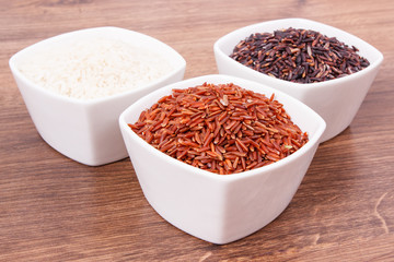 White, red and black rice in glass bowl, healthy food and nutrition