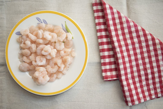frozen prawns in a white dish