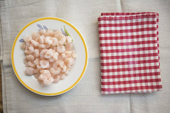 frozen prawns in a white dish