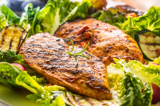 Chicken breast. Grill chicken breast with lettuce salad zucchini and radish