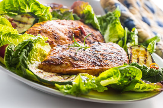 Chicken breast. Grill chicken breast with lettuce salad zucchini and radish