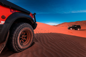 Fototapeta na wymiar 4x4 vehicles and dunes