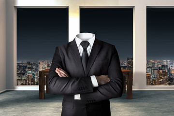 headless businessman with crossed arms in modern urban office - obrazy, fototapety, plakaty