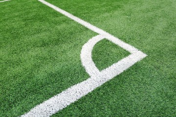 Corner Soccer field or football field texture background. White lines on green grass. Sport background concept.