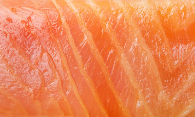 Red fish fillet texture as food background. Close up.