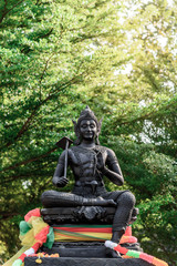 Vishnu god monument with the tree background