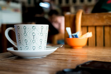 Coffee cup on the table with soft light
