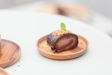 ิbeautiful desert cake on wooden tray